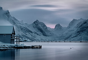 landscape photography of building over mountain during winter time