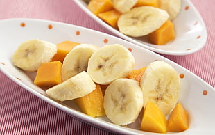 sliced banana and mango on plate