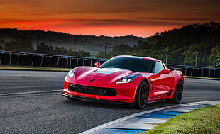 red sports car on track HD wallpaper