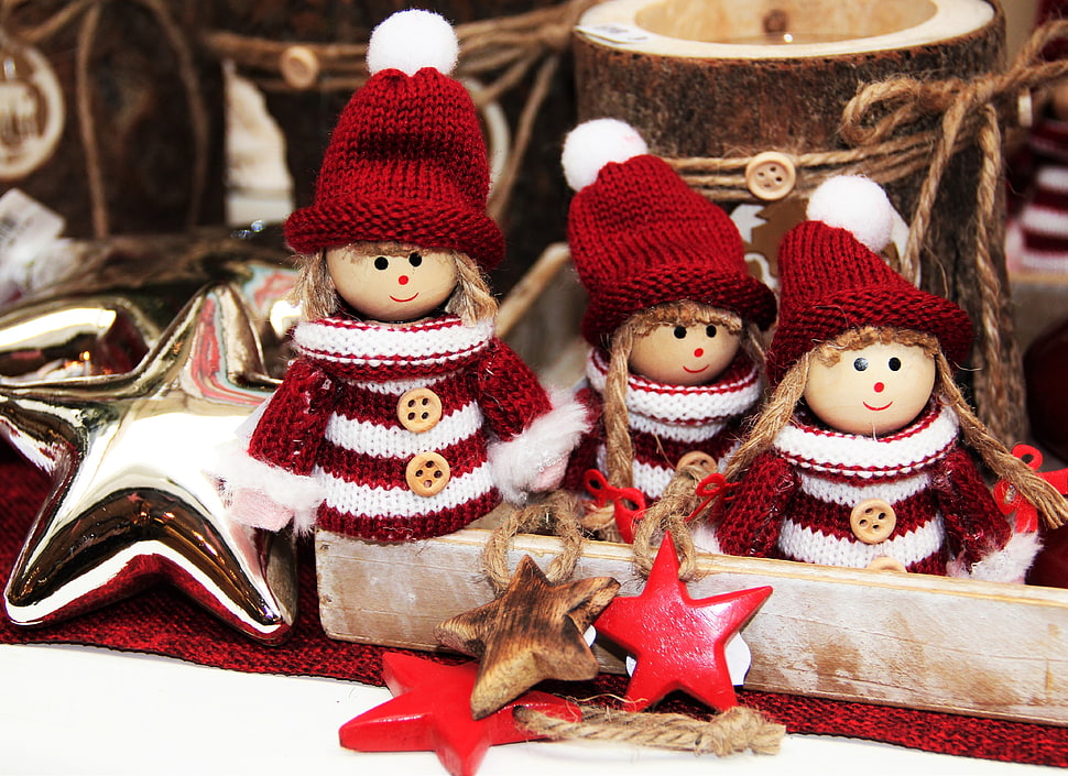 three female wearing maroon-and-white top and hat Christmas decors HD wallpaper