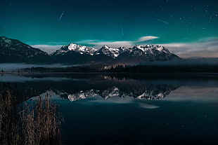 snow-capped mountains near body of water at daytime HD wallpaper