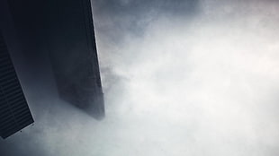 black Sony PS3 game console, clouds, mist, building, city HD wallpaper