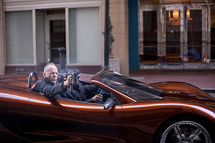 Bruce Willis on sports car HD wallpaper
