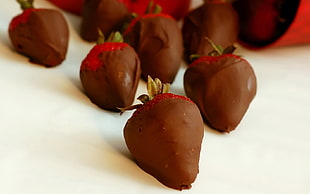 selective focus photo of chocolate coated strawberries