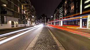 timelapse photography of car lights near city building during night time HD wallpaper