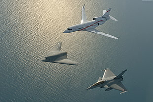 aerial photography of airplane and two fighter jets
