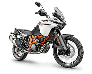 black, white, and orange standard motorcycle