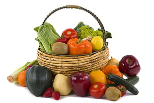 assorted fruits and vegetables in and around wicker basket