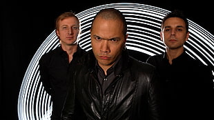three men wearing black top