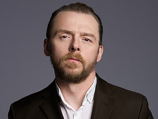 Celebrity wearing black and white formal suit