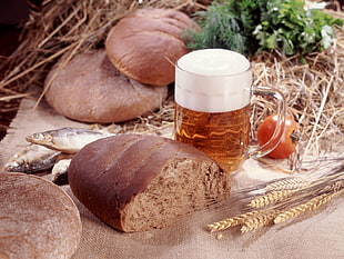 baked bread with honey in glass container