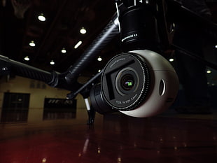 closeup photo of white and black quadcopter camera