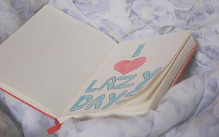 i love lazy days printed on white book HD wallpaper