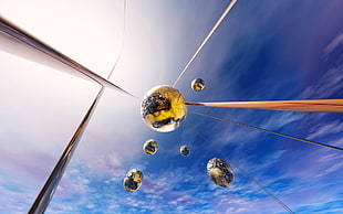 optic illusion photography of balls falling from the sky