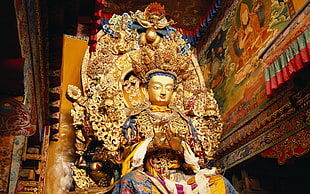 beige and blue Buddha statue