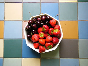 strawberries and berries on bowl