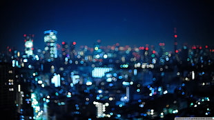 lighted high-rise buildings, city, bokeh, night