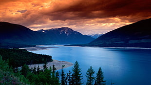 blue body of water, sunset, clouds, mountains, lake