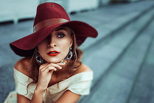 woman wearing red suede sunhat