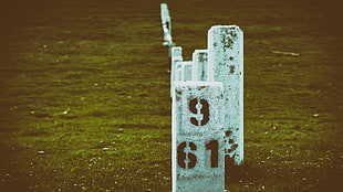 gray concrete post, landscape, numbers