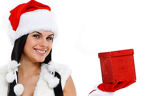 woman wearing Christmas hat and holding gift box