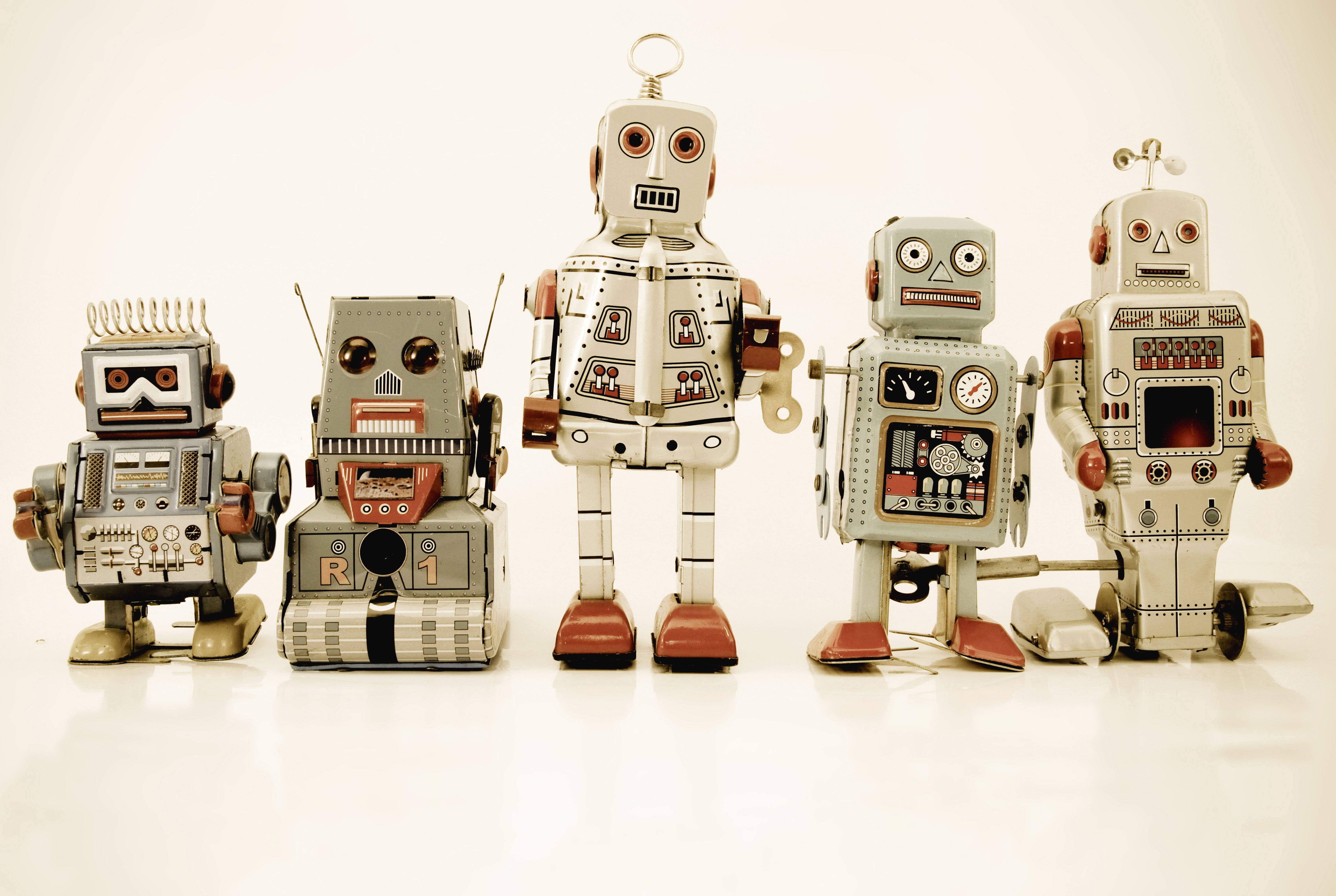 five assorted type of robot toys wallpaper