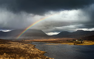 rainbow near mountains and lake HD wallpaper