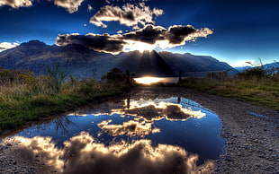 reflective photography of cumulus clouds