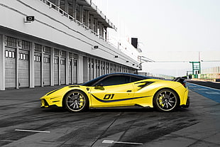 yellow and black sports coupe near white building during daytime HD wallpaper