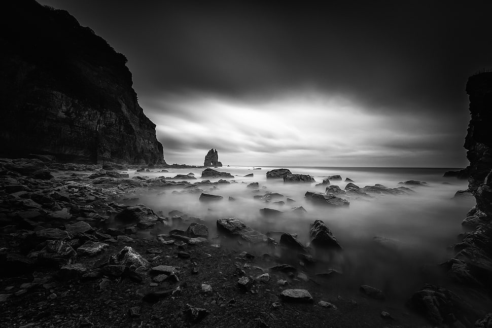 grayscale photo of rocks covered in fog HD wallpaper