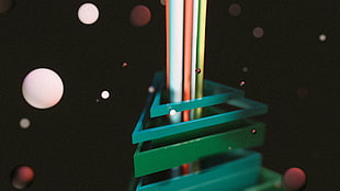 closeup photo of triangular teal and green metal-framed rack