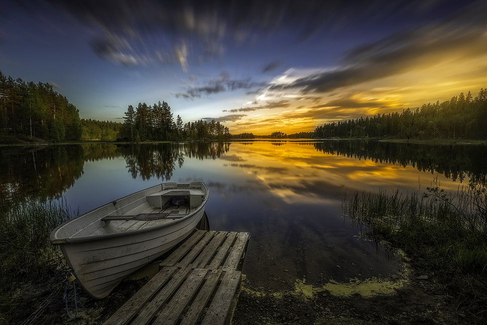 white boat beside brown wooden dock in body of water in timelapse photography HD wallpaper