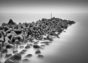 grayscale photo of rock formation with fogs HD wallpaper