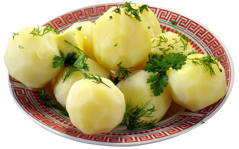 potato with parsley leaf served on red Greek key pattern printed plate HD wallpaper