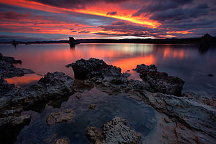 seashore stone beside body of water under horizon photogrpahy, mono lake
