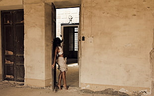 woman standing on door