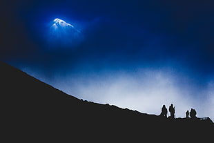 silhouette of person on mountain hill
