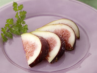 four brown sliced fruits on clear glass plate HD wallpaper