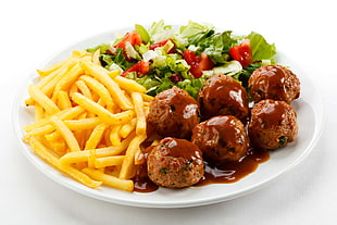 meat balls and potato fries with vegetables