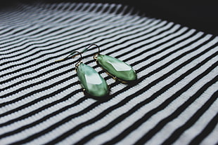 pair of green gemstone hook earrings HD wallpaper