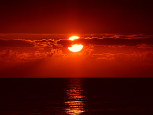 silhouette image of body of water during golden hour HD wallpaper