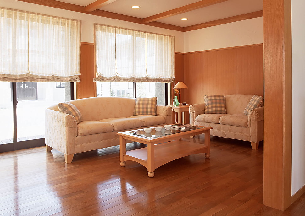 brown fabric couch and rectangular glass top coffee table HD wallpaper