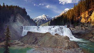 waterfalls near gray mountain during daytime