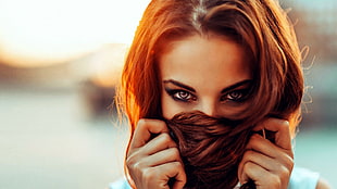 shallow focus of woman covering her face with her brown hair HD wallpaper