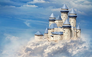 white and blue castle in clouds