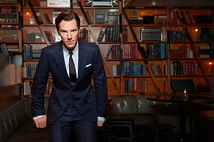 man wearing black blazer and dress pants