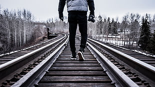 persons walking on train railing HD wallpaper