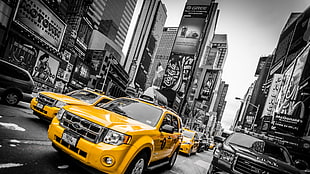 selective photo of yellow sedan at Newyork Timesquare, New York City, taxi, selective coloring, USA