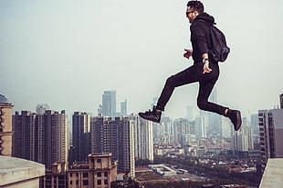 Man Jumping in City HD wallpaper