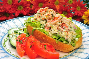 Sandwich on white and blue ceramic plate beside multi-petaled flowers HD wallpaper